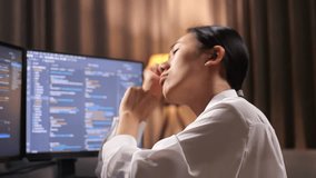 Close Up Of Asian Woman Programmer Celebrating Succeed Creating Software Engineer Developing App, Program, Video Game On Desktop Computer At Home. Terminal With Coding Language 
 - Powered by Shutterstock - Get 15% off with code: PIKWIZARD15
