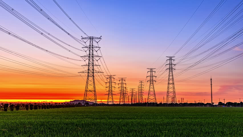 High voltage electric towers at sunrise. Transmission power line. Electricity pylons and sky clouds background. | Shutterstock HD Video #1099738833