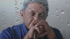 Animation of water drops over senior biracial man leaning on walking cane. Retirement, age, loneliness and senior lifestyle concept digitally generated video.