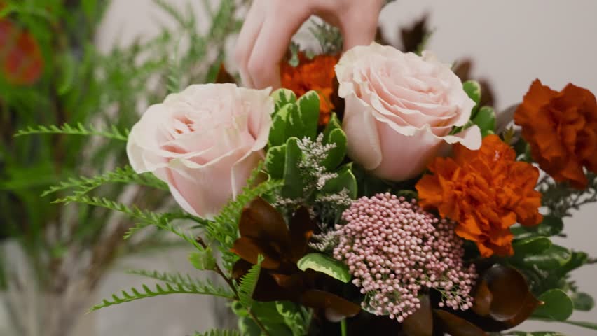 Close up look at various flowers in a V Day bouquet.