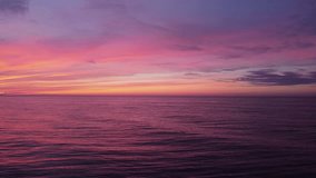 Scenic sunset over the sea with purple and pink colours, colorful nature background for commercial - Powered by Shutterstock - Get 15% off with code: PIKWIZARD15