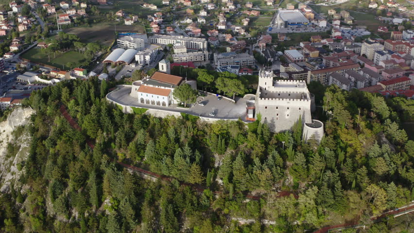 Tight aerial orbiting left shot of Monforte Castle in Campobasso with city in the background