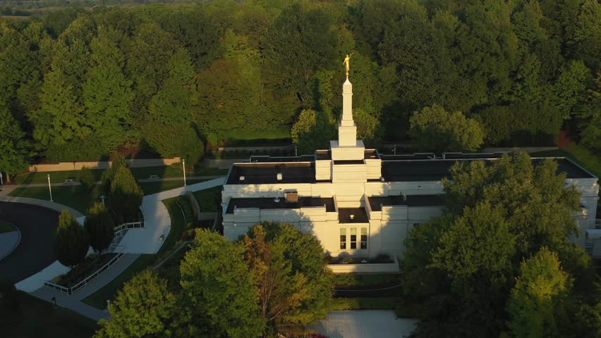 Pull back drone shot of the Palmyra temple near the Joseph Smith family farm, frame house, visitors center, sacred grove in Palmyra New York Origin locations for the Mormons and the book of Mormon.