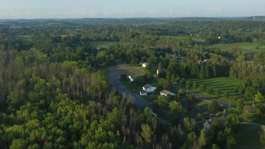 Drone flight over the sacred grove near the Joseph Smith family farm, frame house, temple, visitors center in Palmyra New York Origin locations for the Mormons and the book of Mormon. | Shutterstock HD Video #1099742167