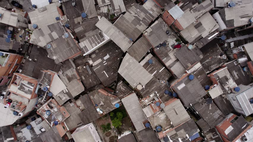 Aerial view above a favela in cloudy Sao Paulo, Brazil - top down, drone shot