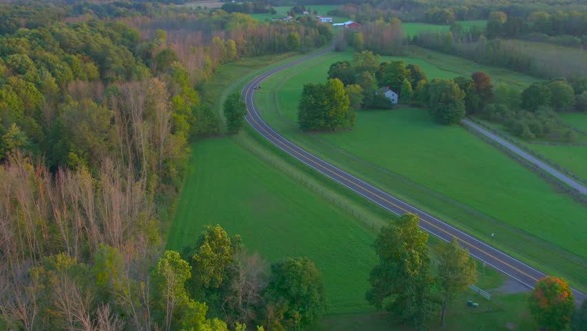 Stafford road drone shot near the Joseph Smith family farm, frame house, temple, visitors center, and the sacred grove in Palmyra New York Origin locations for the Mormons and the book of Mormon. | Shutterstock HD Video #1099743569