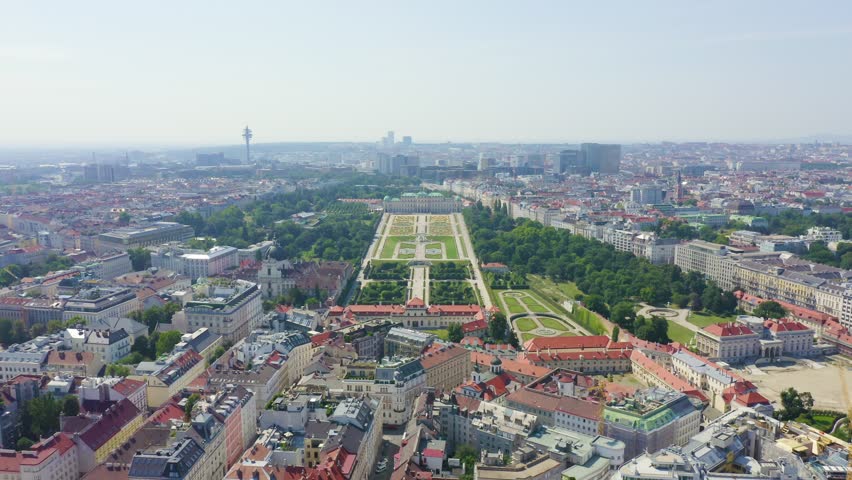 Inscription on video. Vienna, Austria. Belvedere is a baroque palace complex in Vienna. Built by Lucas von Hildebrandt at the beginning of the 18th century. Arises from blue water, Aerial View