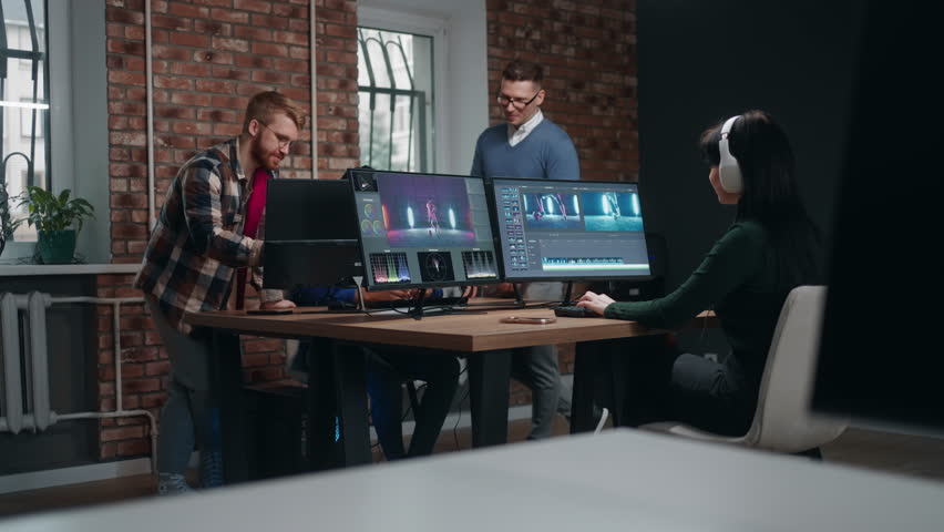 teamwork in creative video production company, woman editing musical video, making final cut