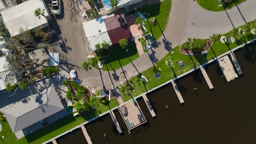 Badly damaged mobile homes after hurricane Ian in Florida residential area. Consequences of natural disaster