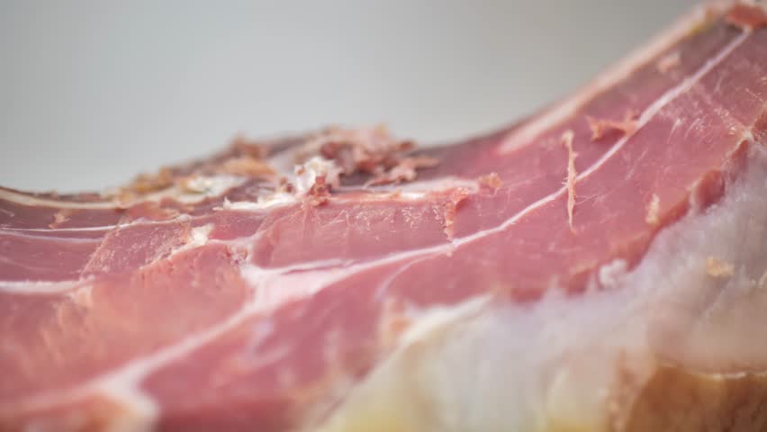 Cut juicy appetizing jamon, close-up. Spanish jamon. | Shutterstock HD Video #1099756735
