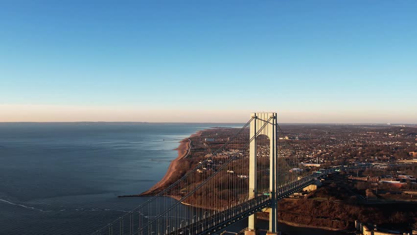 Descending Aerial view in front of Staten island and the Verrazzano-Narrows bridge, in sunny NY, USA | Shutterstock HD Video #1099757097