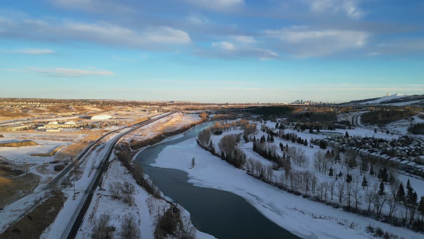 The community of Valley Ridge in Calgary Alberta is seen from an aerial drone view during sunset.