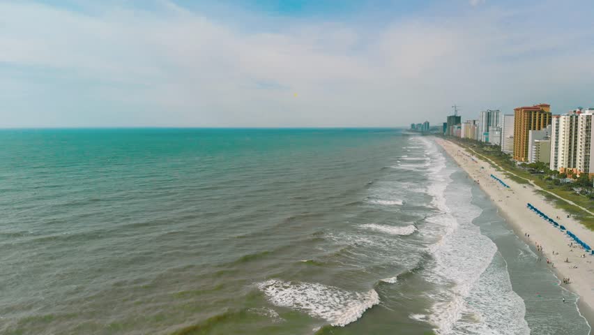 Stunning areal video sequence of coastline and residential area near the coast at Myrtle Beach, South Carolina, USA. 