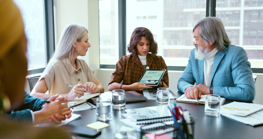 Business people, tablet and teamwork for planning, strategy and ideas by desk in modern office for goal. Corporate group, digital tech and finance team for brainstorming, vision or target in New York | Shutterstock HD Video #1099764181