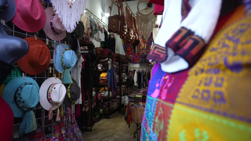 Hats and colorful blouses and clothing in a tourist souvenir shop in Merida, Yucatan, Mexico.