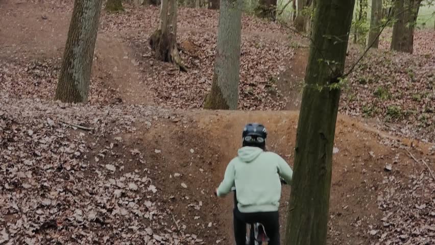 mountainbiker jumping and doing a 360