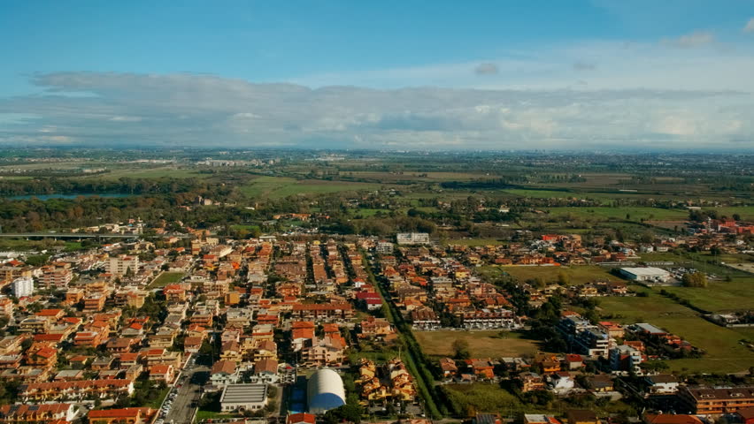 Aerial view of the outskirts of Rome, Italy including River Tiber, Isola Sacra and the surroundings of Rome Fiumicino Airport
 Royalty-Free Stock Footage #1099769699