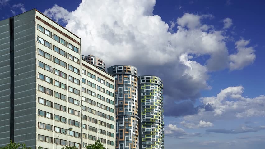 Buildings of a new residential complex against the background of the sky with clouds  (time lapse, with zoom), Moscow, Russia