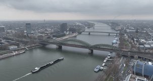 A breathtaking aerial video of Cologne's famous bridge and bustling city center showcasing its stunning skyline, historic landmarks, and vibrant street life.