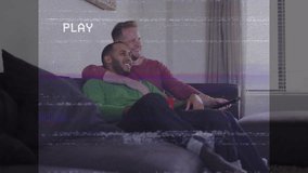 Animation of interference over diverse male couple embracing and watching tv. Valentine's day, love and celebration concept digitally generated video. - Powered by Shutterstock - Get 15% off with code: PIKWIZARD15