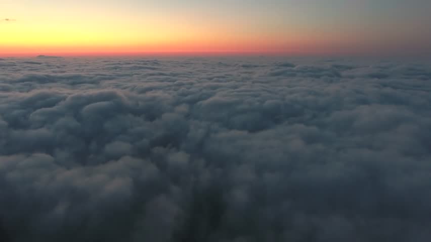 Aerial view of like heaven idyllic view above the clouds before sunrise.
