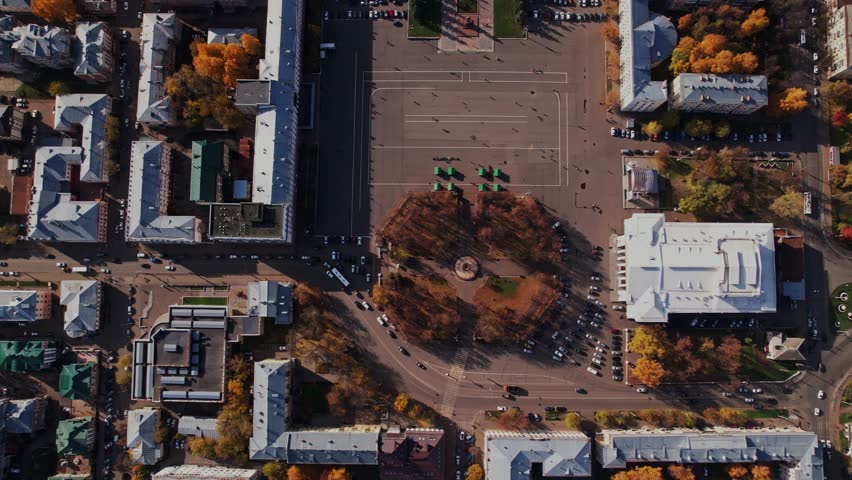 Birds-eye view over city streets, rooftops and dense urban blocks