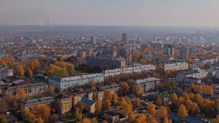 Birds-eye view over city streets, rooftops and dense urban blocks