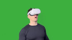 a man in a virtual reality helmet admires the metaverse then ducks and looks at the ru - Powered by Shutterstock - Get 15% off with code: PIKWIZARD15