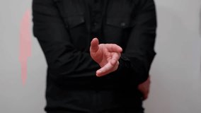 man in black shirt making gestures with his hand as if he were using a digital touch screen, white background, usable for technology and other topics