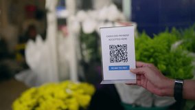 4K Attractive girl using smartphone with mobile banking application scanning QR code making electronic online payment buying fresh flower with mother at street market florist shop on summer vacation. - Powered by Shutterstock - Get 15% off with code: PIKWIZARD15