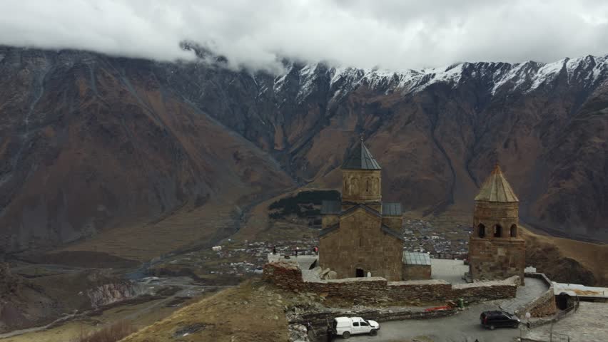 4K Drone Kazbegi trinity church rotation close