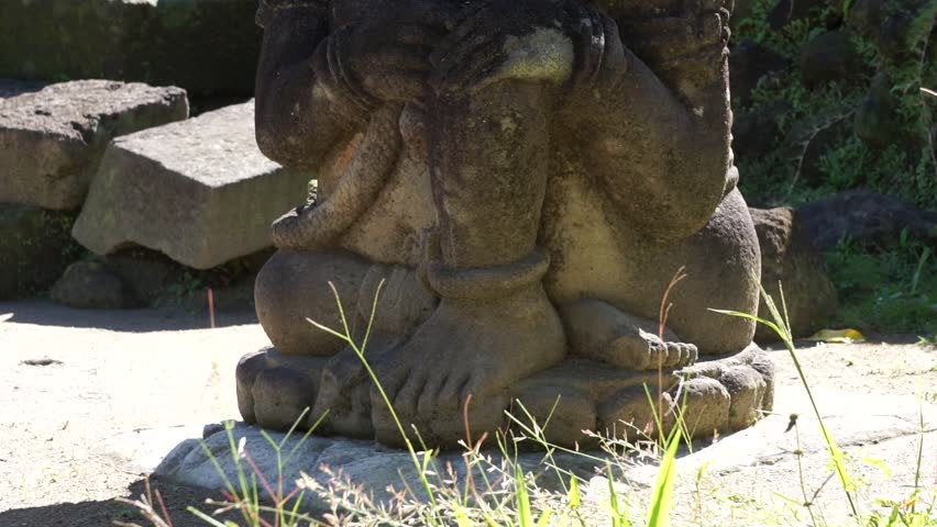 Dwarapala in gambar wetan temple. This Temple was built during the Majapahit Kingdom after the reign of Hayam Wuruk. Dwarapala functions as a guard in charge of guarding the entrance to a holy area Royalty-Free Stock Footage #1099794177