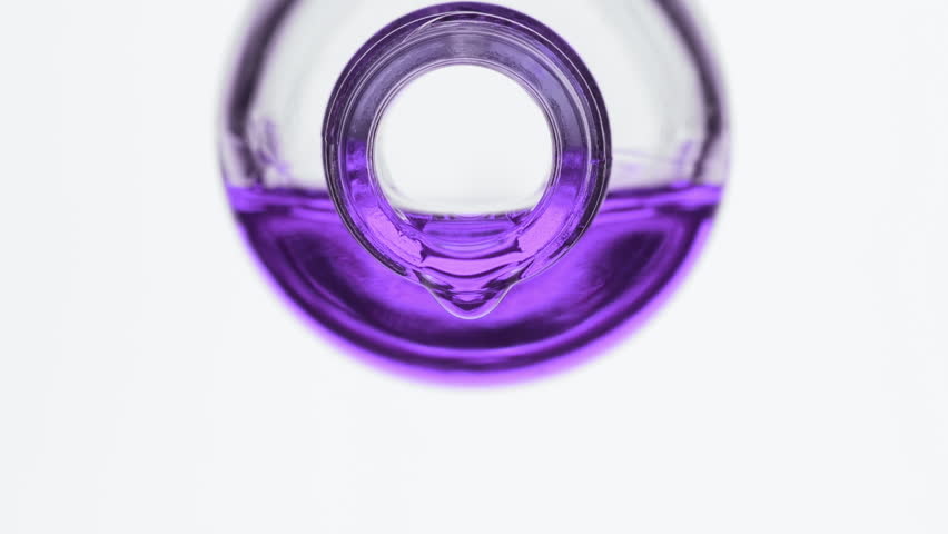 Side view macro shot of purple oil is dripping from reagent bottle on grey background | Abstract skin nutrition cosmetics ingredients formulating concept