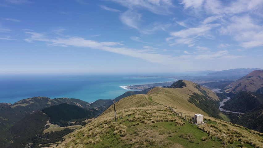 Kiakoura hills and New Zealand mountains aerial footage overlooking the beach.