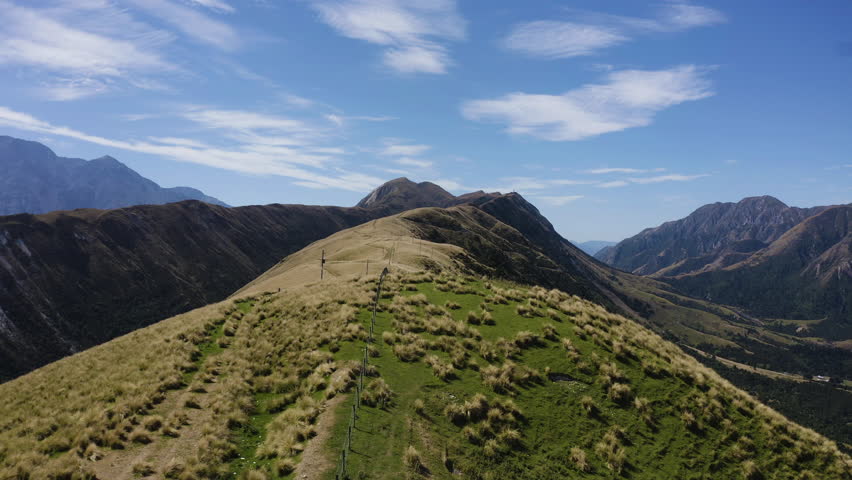 Aerial flowing thru the rolling Hills and Mountains of New Zealand overlook the stunning beaches in Kiakoura.
