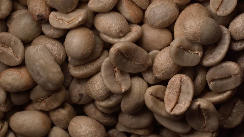 closeup of dry green coffee beans, product of Brazil, imported