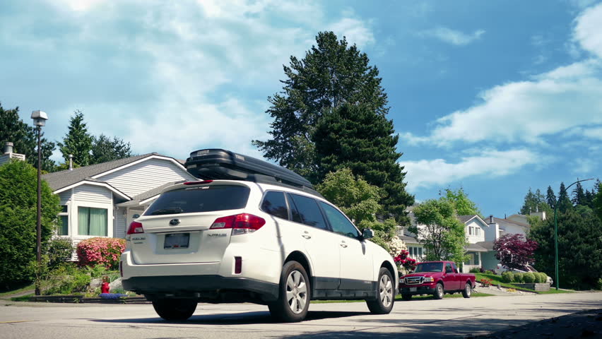 Car Passes Through Nice Residential Area