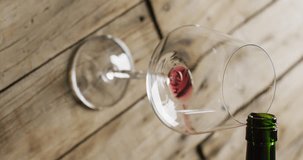 Vertcal video of red wine pouring into glass. Wine, alcohol, beverages, wine tasting and relax concept.