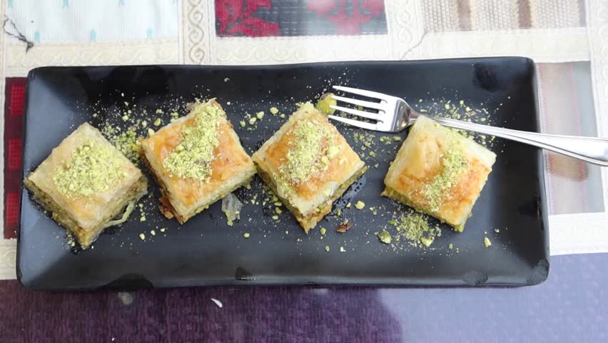 Arabic dessert baklava on a plate  | Shutterstock HD Video #1099816633