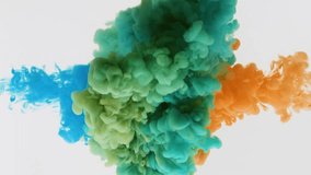 Orange - blue Magic mixing of color. Cloud of silky ink in water isolated on black wallpaper. Colorful ink in water,  drop.ink explosion in slow motion. Acrylic ink in water on a white background. - Powered by Shutterstock - Get 15% off with code: PIKWIZARD15