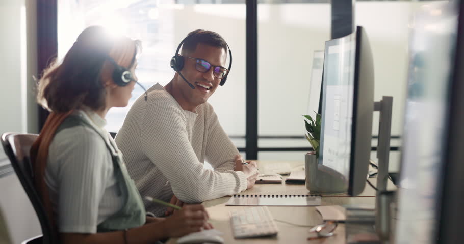Call center, customer service and collaboration with a consulting team working together for help or support. Contact us, telemarketing and teamwork with a man and woman consultant at work in sales | Shutterstock HD Video #1099826991