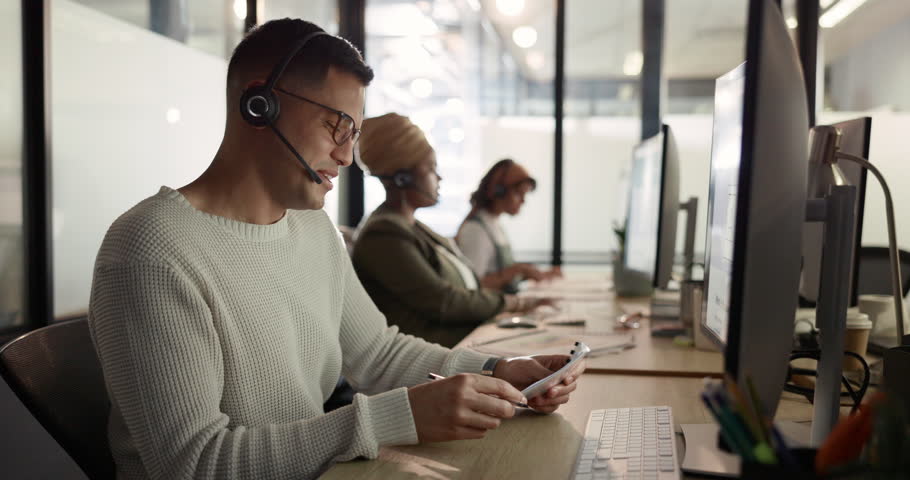 Man tired at call center, burnout and vision problem, focus fail and employee fatigue at customer service job. Contact us, CRM mistake and exhausted with headache and worker desk for customer care. | Shutterstock HD Video #1099827023