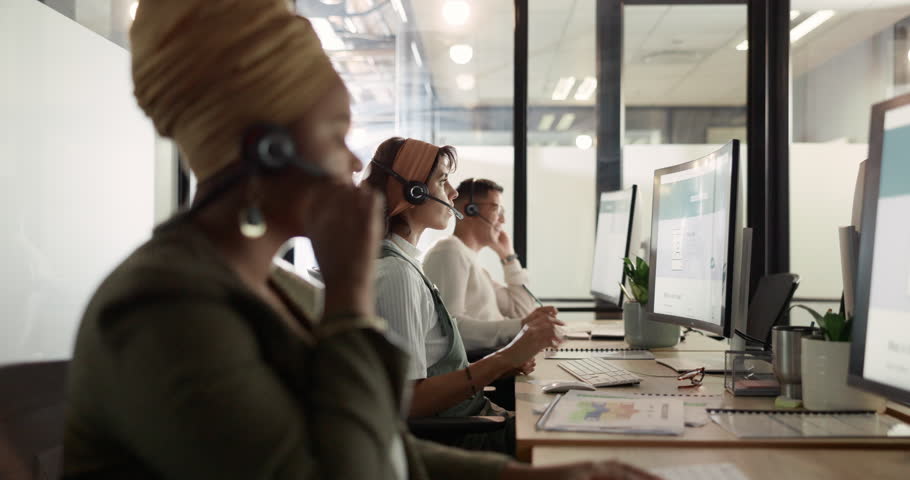 Business, team and consultant for customer service, call center and talking in office. Telemarketing, black woman and agents with headsets, discussion and help for support, computer and consulting. | Shutterstock HD Video #1099827041