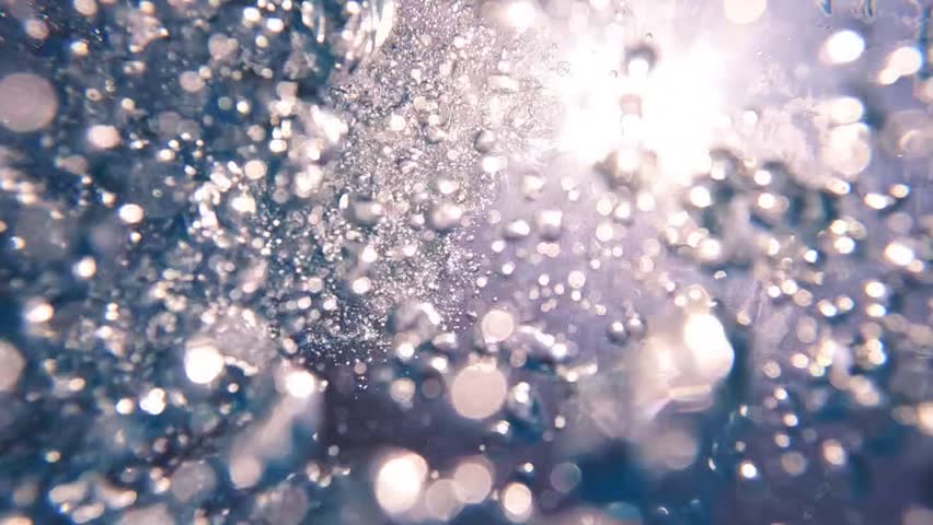 Underwater slow motion loop video of diver releasing air bubbles flowing towards sea surface in tropical exotic bay with deep blue waters | Shutterstock HD Video #1099830729