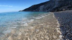 Slow motion video from famous paradise pebble beach of Myrtos one of the best in island of Kefalonia, Ionian, Greece