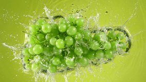 Super Slow Motion Shot of Fresh Green Grape Wine Falling into Water on Green Background at 1000 fps. - Powered by Shutterstock - Get 15% off with code: PIKWIZARD15