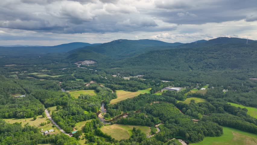 Stinson Mountain, Tenney Mountain and Baker River valley between them from top of Rumney historic center aerial view in summer in White Mountain National forest, Rumney, New Hampshire NH, USA. 