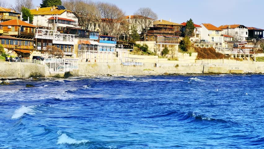 Beautiful view of the old part of Nessebar (Melsambria) Bulgaria, Europe - Floating seagulls on the sea - Nature 4K Video. Color Correction