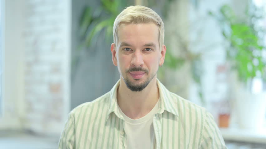 Modern Young Man Waving Hand to Say Hello