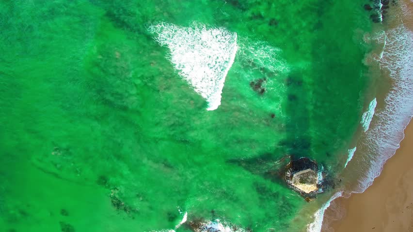 The Twelve Apostles along Great Ocean Road in Victoria, Australia. Port Campbell National Park on a beautiful sunrise, aerial view. Slow motion.